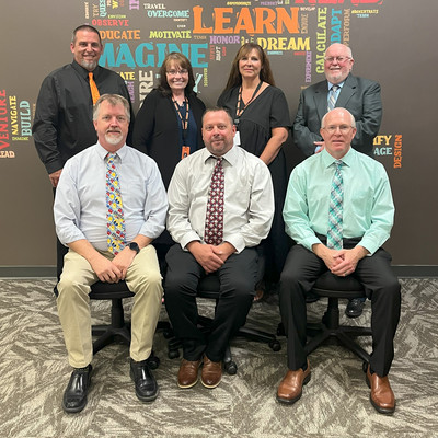 school board members smile for a photo in the RCHS IMC